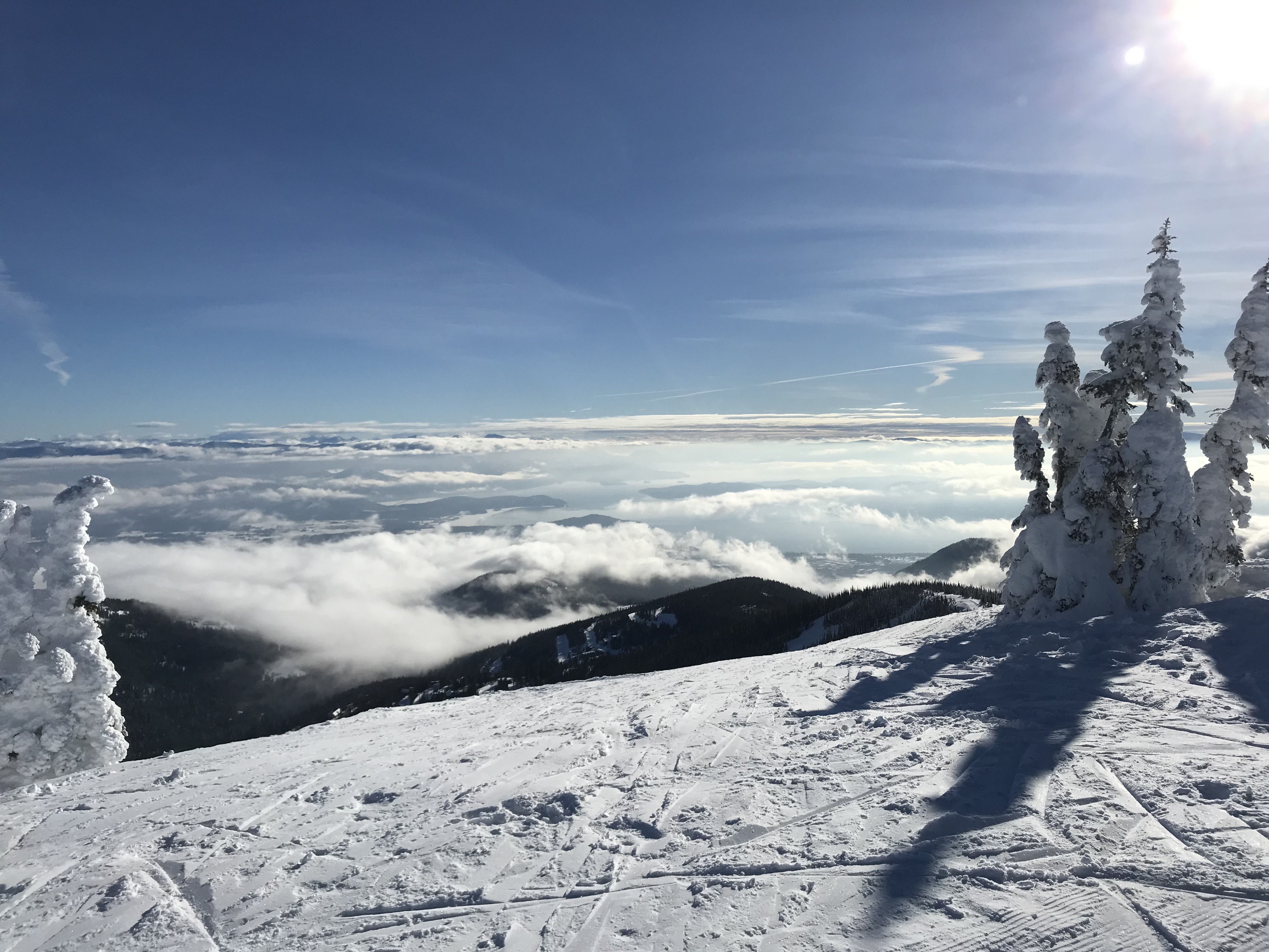 Schweitzer Mountain summit above the clouds in winter